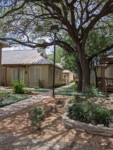 Exterior of The Hidden Garden building and garden grounds in San Antonio